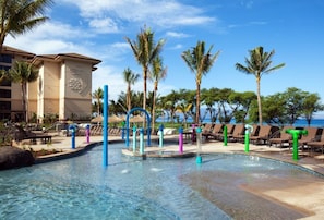 Kids pool has fun water features. And there's plenty of room to lounge poolside.