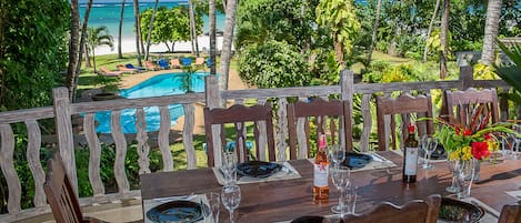 Monkey Beach House- Dining area with pool and seaviews