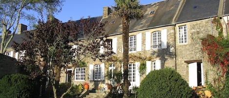 Exterior of house from large walled in garden