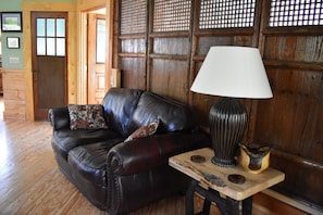 one side of the living room. bathroom door and bedroom door