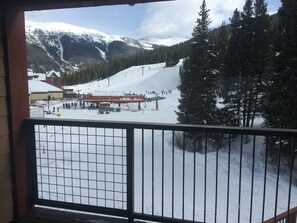 Huge LR balcony with views of the sky chutes, lift and National Forest