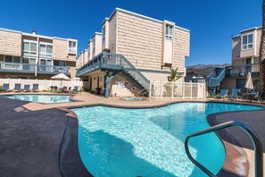 Two pools, hot tub, and two bathrooms with showers.