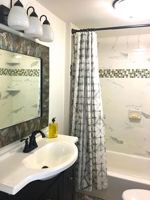 Full bath with custom tile.
