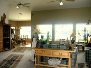 Great room with Southwestern decor and view of lake