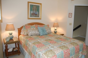 Comfortable queen size guest bedroom on the second floor with a shared bathroom