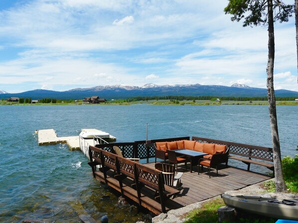 Deck with comfortable seating, and dock, right on the Island Park Reservoir!
