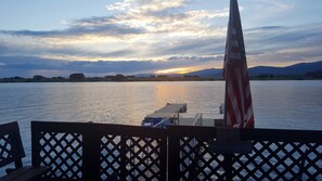 View of Island Park Reservoir and the dock from our deck, facing the sunset.