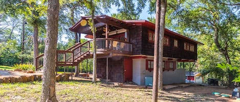 The Treehouse welcomes you with an over-sized deck & entry.