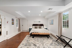 Main floor primary bedroom. King size bed.