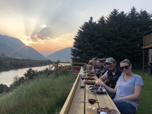 Friend enjoying dinner on the shared bar overlooking the Yellowstone River.