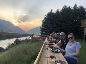 Friend enjoying dinner on the shared bar overlooking the Yellowstone River.