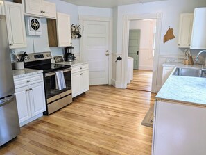 you enter into a newly renovated kitchen
