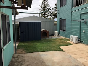 Lawn area and kennel.