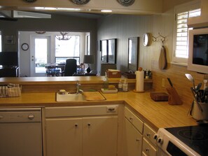 Kitchen with view to lake, fully equipped incl'g separate ice maker & compactor.