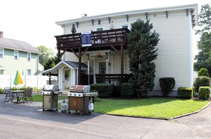 Backyard patio area, small covered deck and BBQ grill