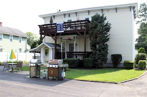 Backyard patio area, small covered deck and BBQ grill