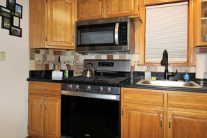 Modern kitchen with over the range microwave...