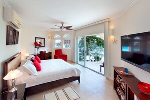 Master with king sized bed & cable TV opens onto the 200 sq. ft. terrace.