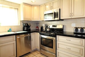 Modern kitchen with Tuscan glazed cabinetry