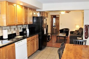 Roomy kitchen with open floor plan to living room.  Plan your day while cooking breakfast, or recap the day's activities while making dinner!