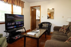 Relax in the comfortable living room and watch your favorite team on the 55" (or larger) smart Roku TV.  Hardwood and tile floors throughout this updated unit.