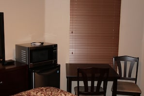 Microwave, fridge, table and chairs