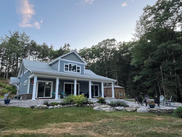 Front view of home, gazebo, gardens, and fire pit area for guests to enjoy! 