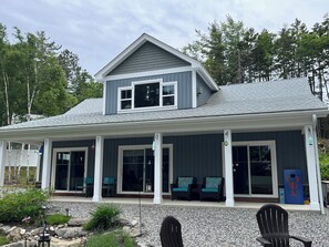 Front view of home with seating on porch