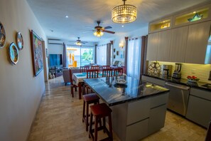 Kitchen, dining room, living room, with ocean view.