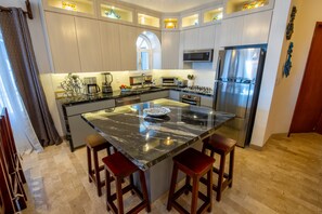 Newly remodeled kitchen with built-in dishwasher and granite countertops.