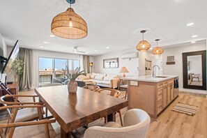 Dining area just off the kitchen and living area. Comfortable seating for 6 at the table and 4 at the bar.