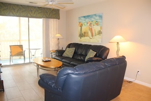 Living room with screened-in patio access