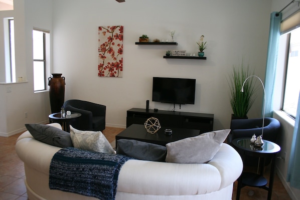 Great room, comfortable seating and mounted TV