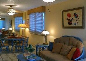 Reverse Angle of Living room & Dining room. Walled mirror reflects ocean/beach.