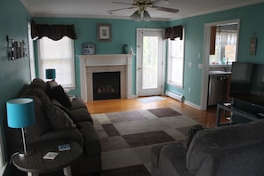 Living room with door to deck