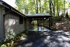 Home side view with covered parking