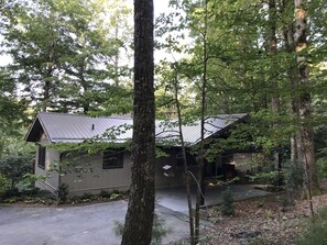 Upgraded secluded home on a private wooded lot with lake access.