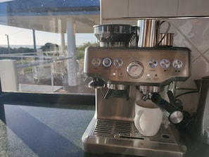Happiness is drinking your own, freshly ground coffee, looking at the ocean!