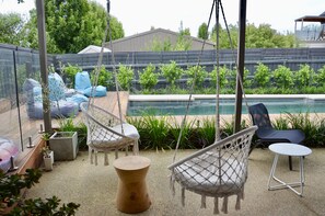 Outdoor lounge setting with super relaxing swings.  You won't want to get out!