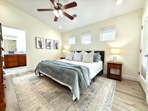 Master bedroom with king bed and Roku television 