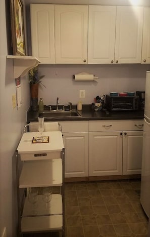 Kitchen includes silverware, wine glasses, coffee maker etc.
