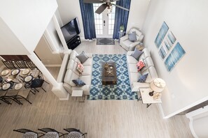 Open living area with direct access and views to the pool and lake