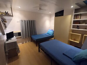 2nd floor bedroom overview. Sleeps two (possibly up to three), TV with Netflix and study/work space.