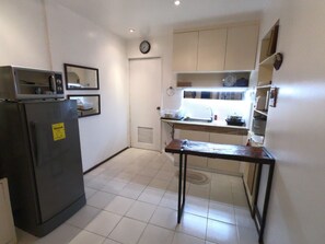 Prepare a hearty meal. The kitchen comes with the essential appliances, cookware