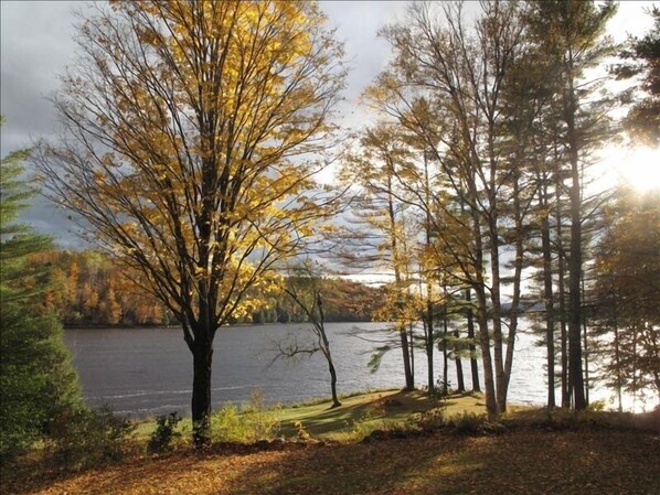 View of the lawn and river from the porch and living room.