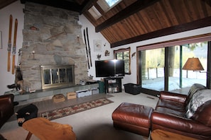 Living room opens to our large Deck w/ Table & Chairs & gas BBQ