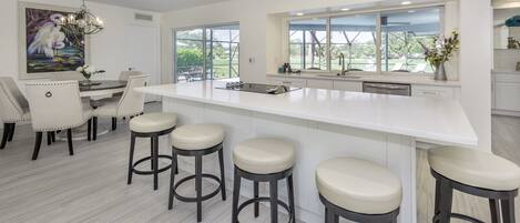 Island bar top counter with swivel barstools