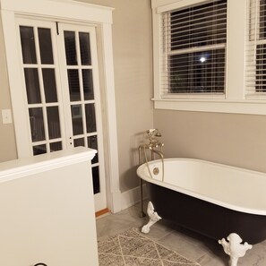 Master Bedroom Clawfoot Tub with access to the upstairs porch.