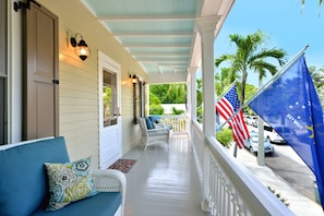 Peaceful second story balcony overlooks historic Elizabeth St.