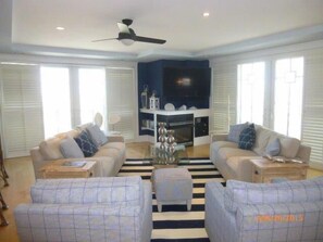 Enjoy the 60" TV with surround sound. 